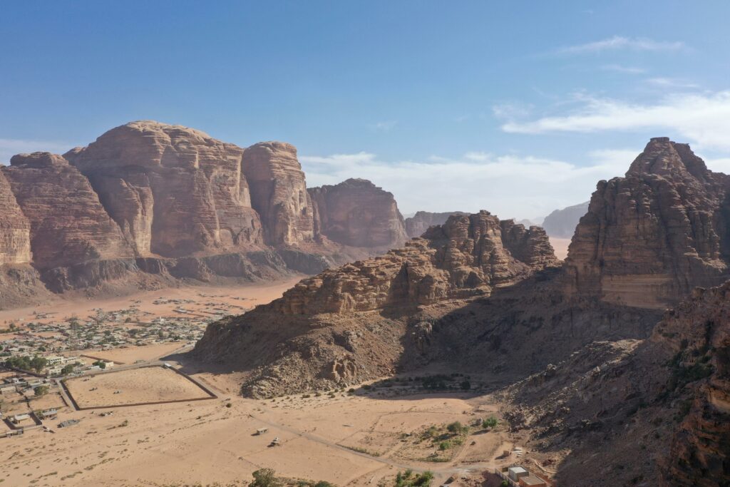 A breathtaking view of Wadi Rum's iconic desert rock formations under a clear blue sky.