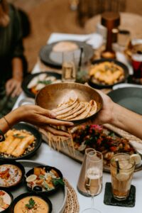 A lavish spread of exotic dishes on a beautifully set dining table, capturing a luxurious dining experience.